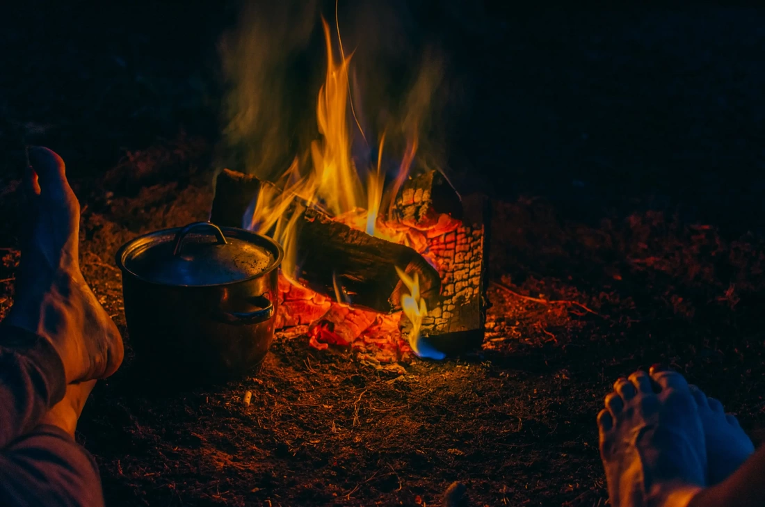 cooking around the firepit glamping