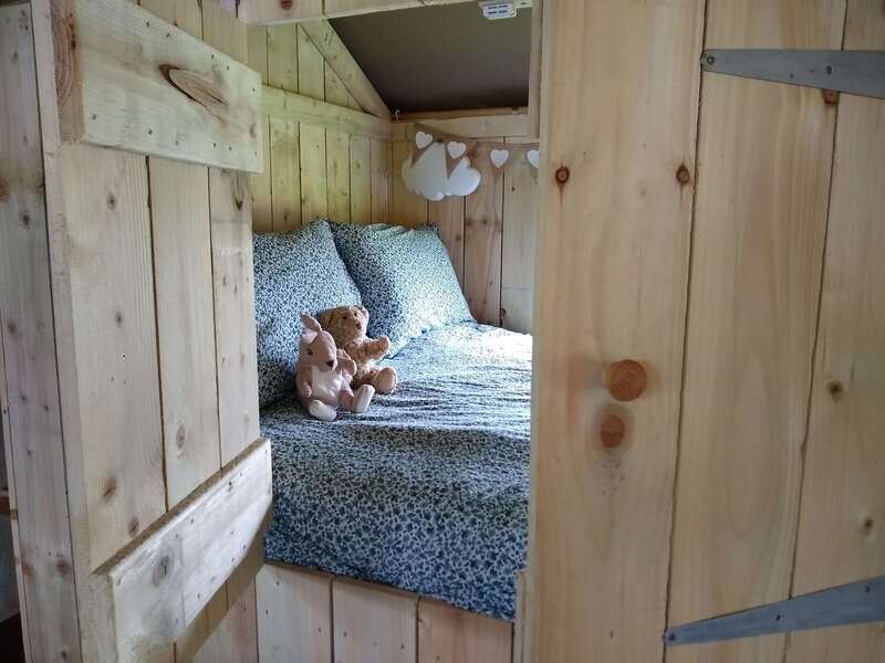king cupboard bed in safari tent for children 