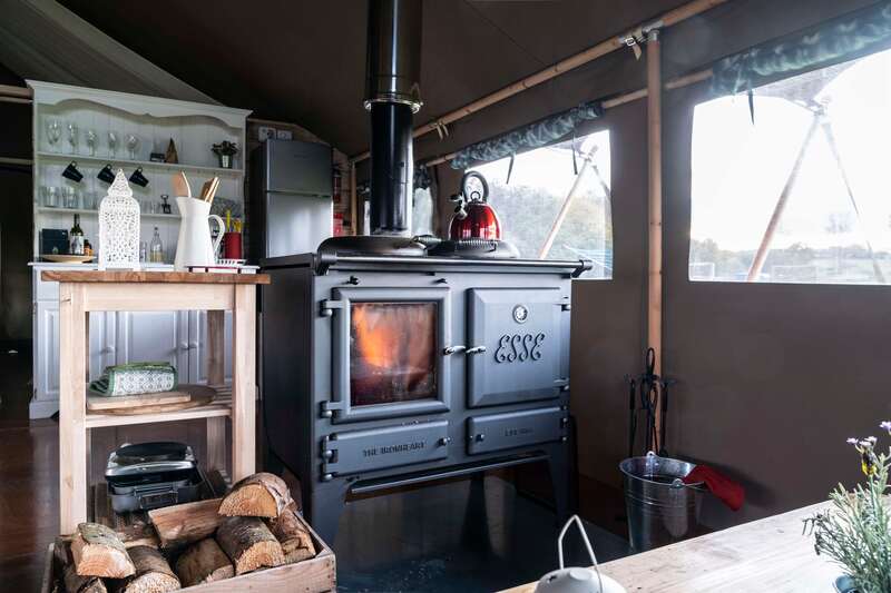 wood stove in luxury safari tent