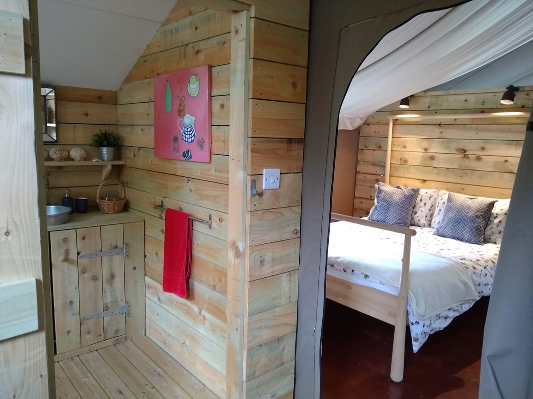 Safari tent bedroom with ensuite bathroom