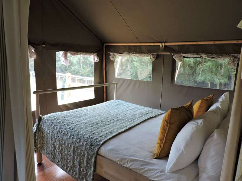 luxury glamping king bedroom in safari tent